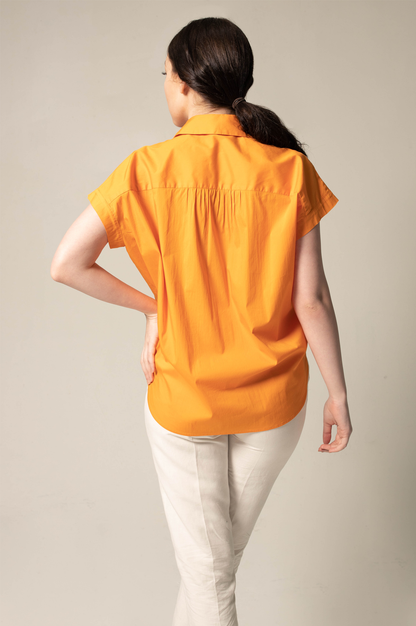 Camisa de mujer con cuello fruncido en color naranja