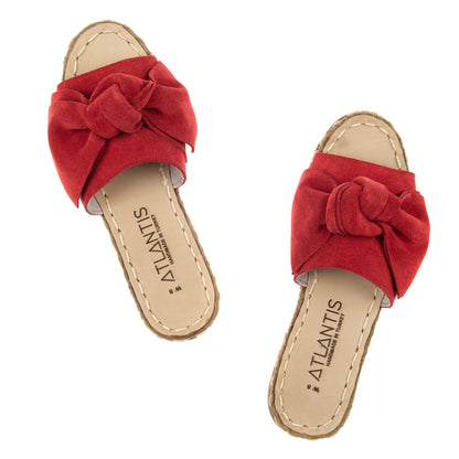 Sandalias de piel con lazos rojos